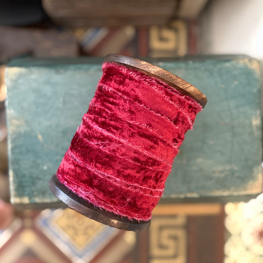 Very Large Spool Of Frayed Red Velvet Ribbon